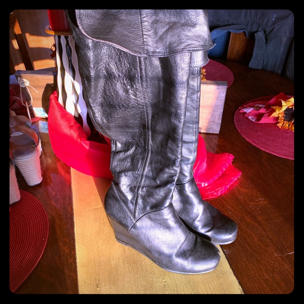 Tall black wedge boots